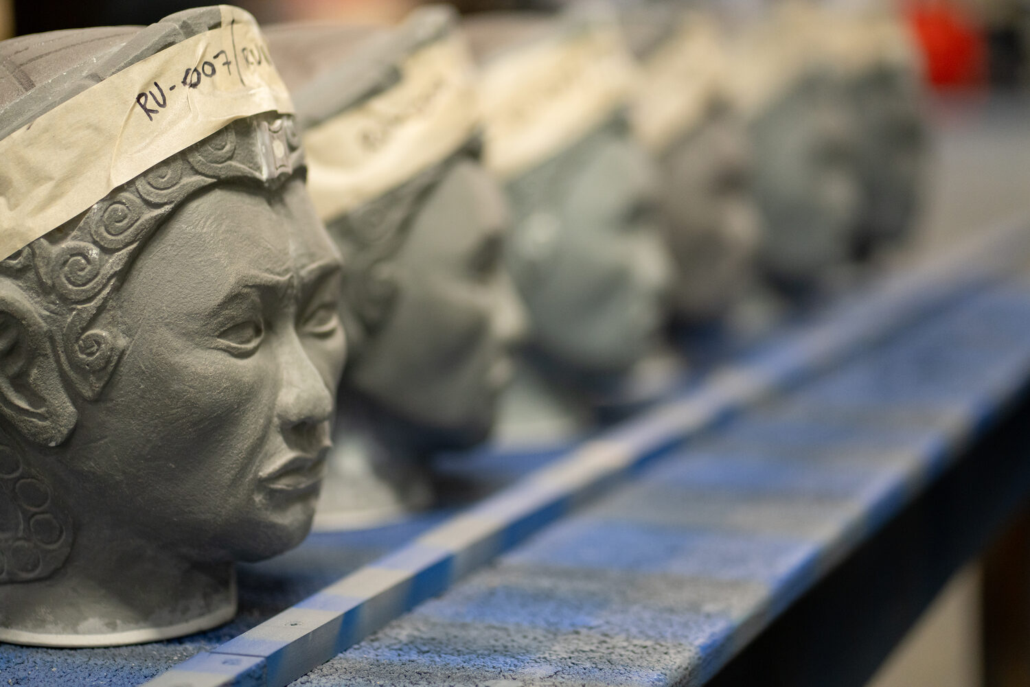 Hand-sculpted character heads on the production line